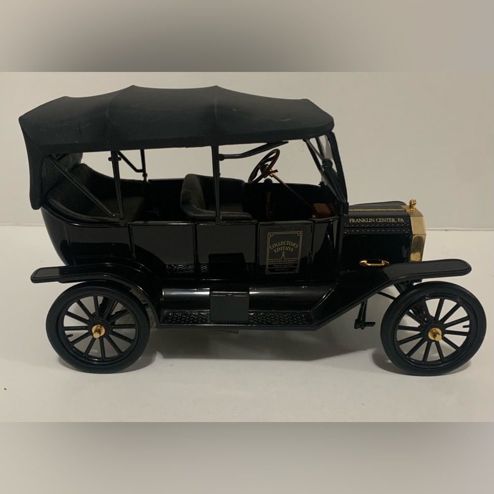 Vintage Black Model Car with Gold Accents